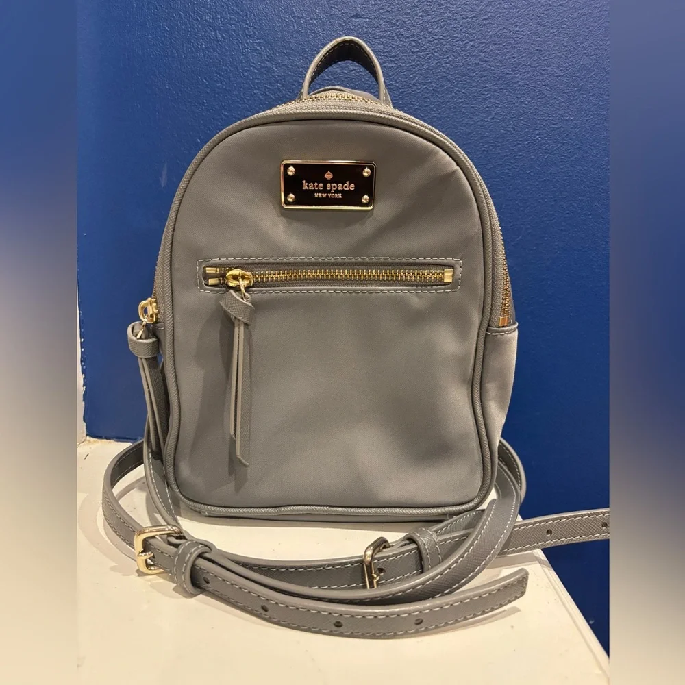 Kate Spade New York Mini Bradley nylon backpack in gray with gold zippers